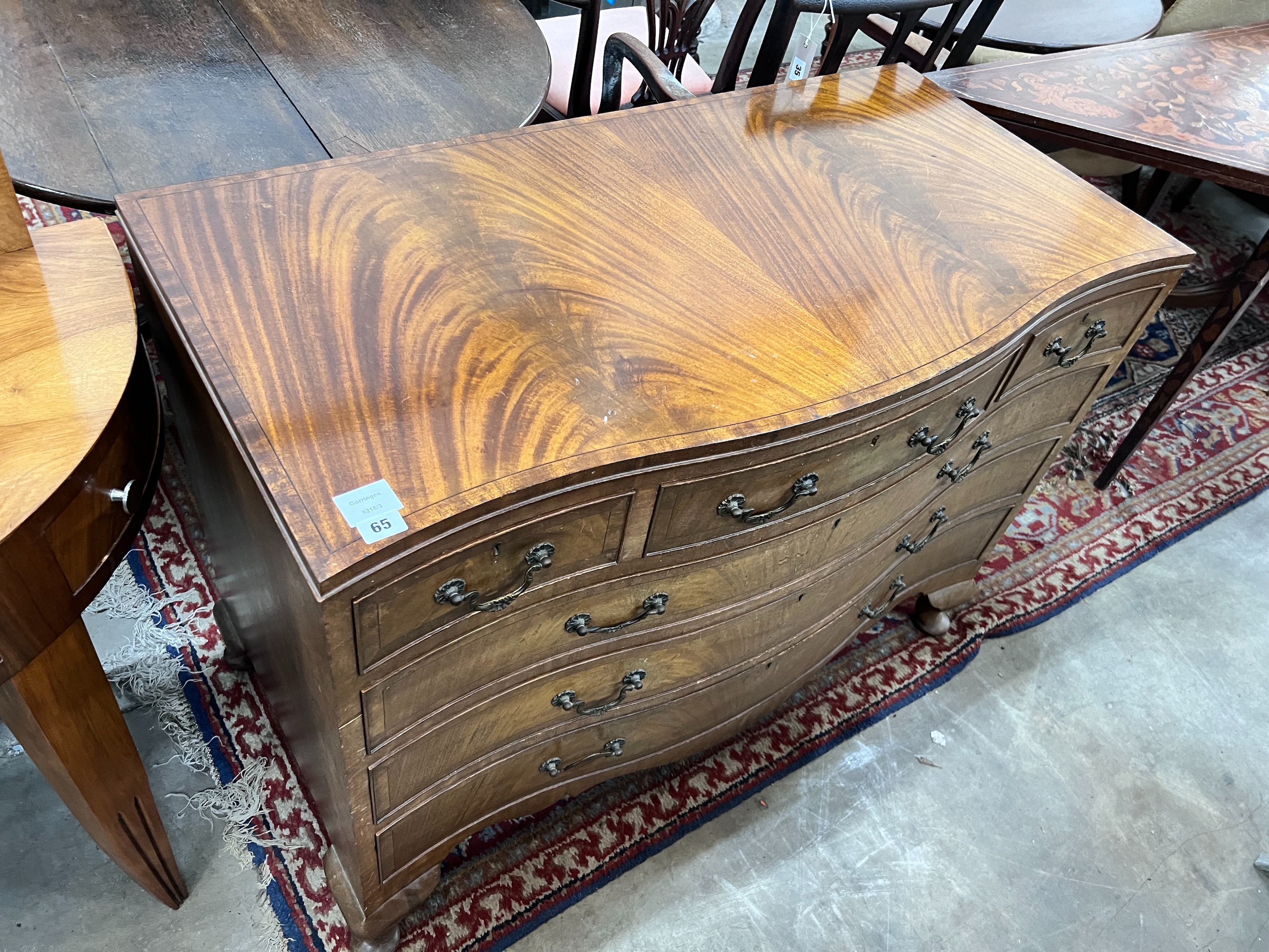 A reproduction George III style mahogany serpentine chest, width 107cm, depth 54cm, height 80cm *Please note the sale commences at 9am.